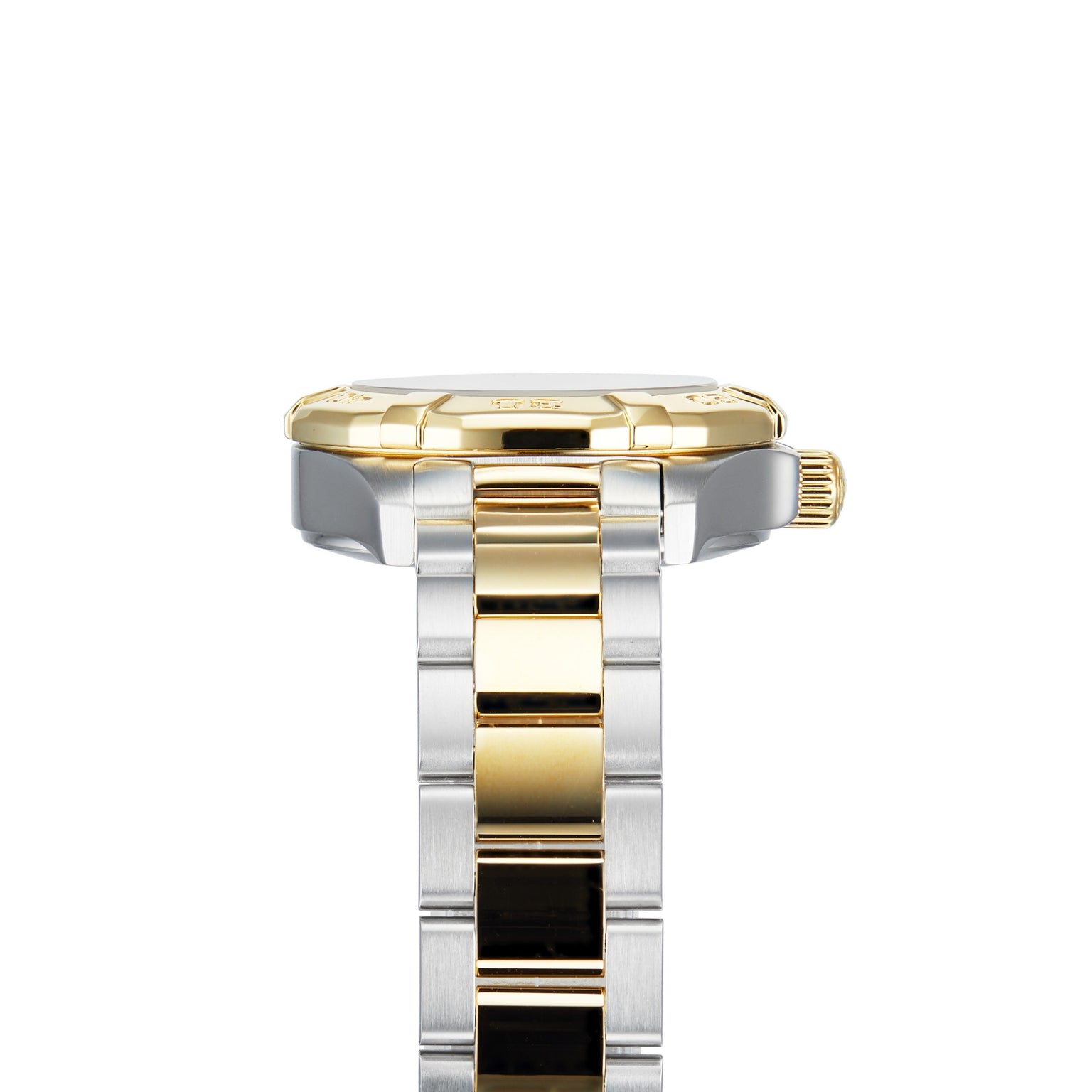 Close-up side view of the TAG Heuer Aquaracer Date wristwatch with a gold bezel and crown, crafted in stainless steel and 18K gold, featuring a silver and gold link bracelet against a white background.