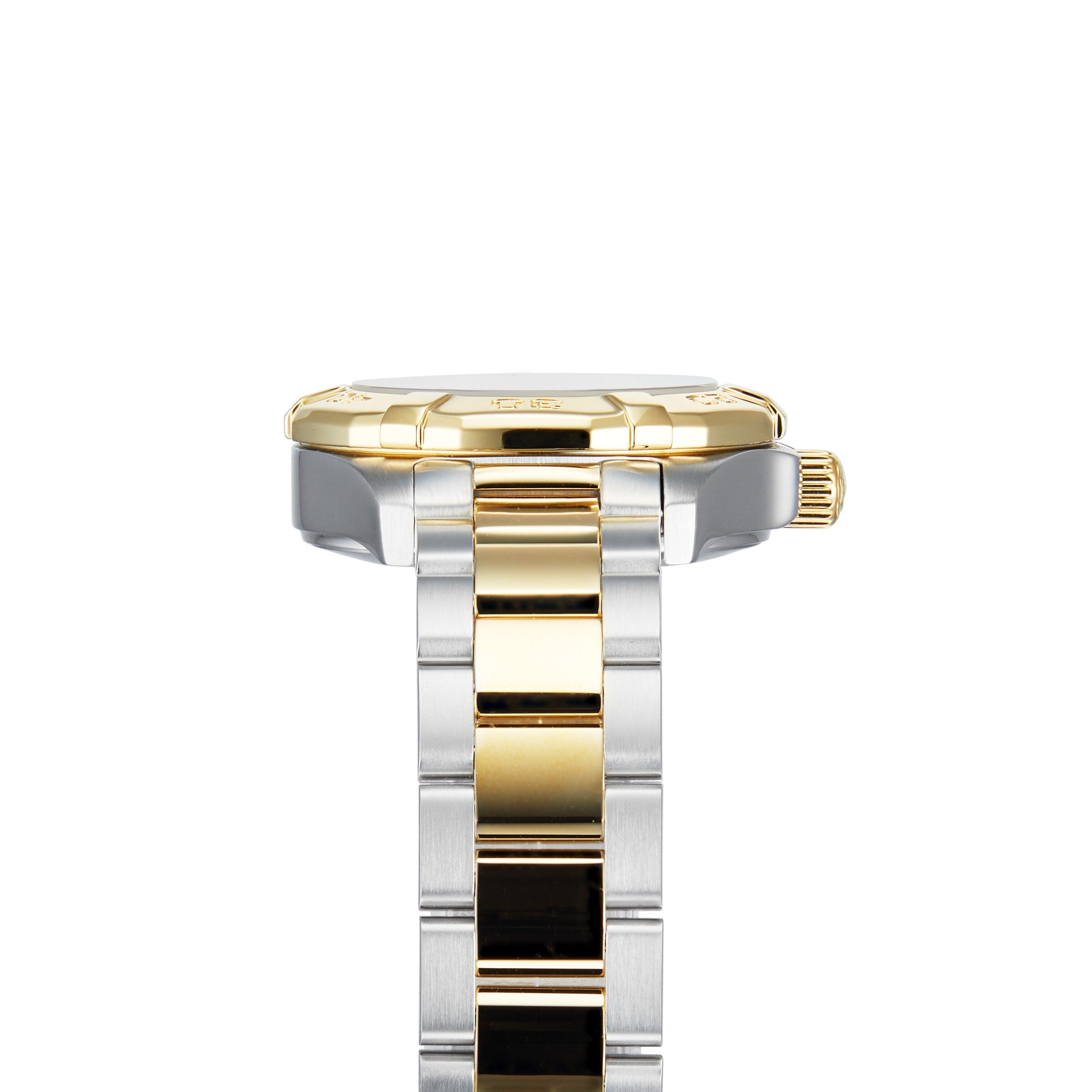 Close-up side view of the TAG Heuer Aquaracer Date wristwatch with a gold bezel and crown, crafted in stainless steel and 18K gold, featuring a silver and gold link bracelet against a white background.