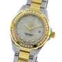 The TAG Heuer Aquaracer Date watch features a two-tone metal band, gold accents, and a diamond-set bezel.