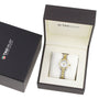 A TAG Heuer Aquaracer Date wristwatch with a stainless steel and 18K gold band is presented in an open branded box, with the outer box placed to the left.