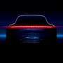 Rear view of a Porsche 911 Carrera S with glowing taillights, set against a dark background—a striking tribute to the legacy behind the TAG Heuer Special Edition Carrera Chronograph x Porsche.