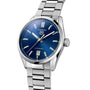 The TAG Heuer Carrera Date is a stainless steel watch with a blue dial, silver hour markers, date at 6 o’clock, stainless steel bracelet, and is powered by the Calibre 5 automatic movement.