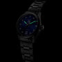 A TAG Heuer Carrera Date automatic watch with a blue sunray dial, diamond hour markers, and luminous hands is set against a dark background.
