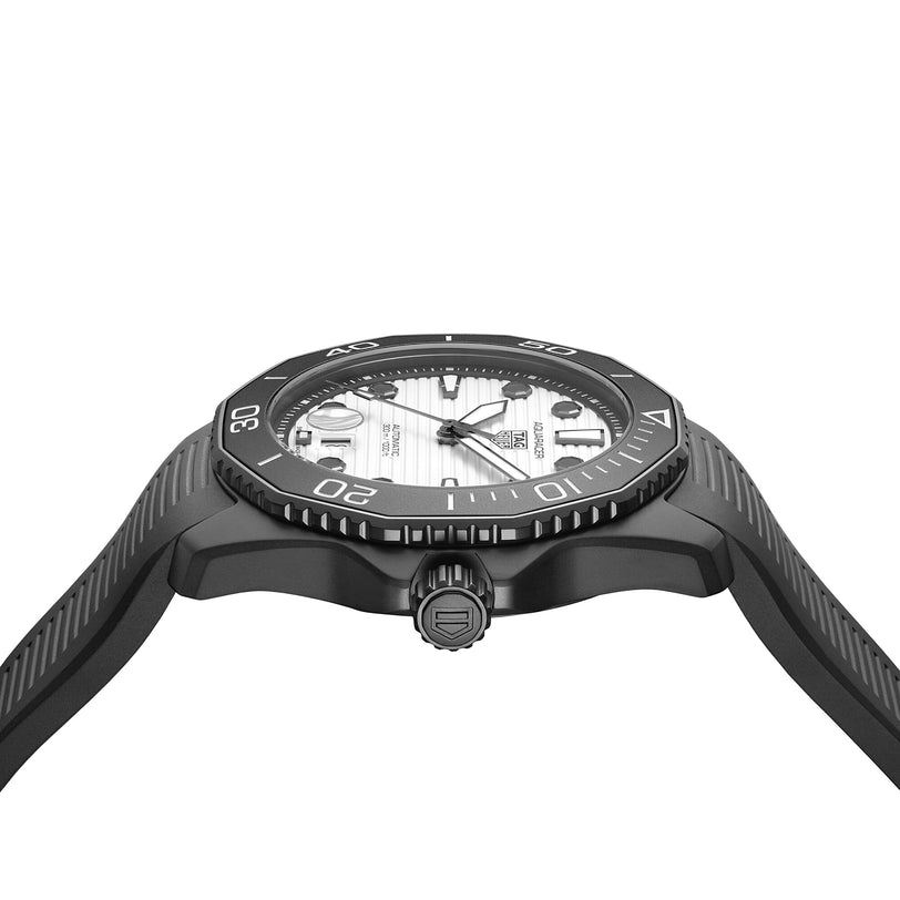 Side view of the TAG Heuer Aquaracer Professional 300 Date, showcasing a white textured dial, black numbered bezel, and black ridged strap—driven by an automatic Calibre 5 movement.