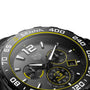 Close-up of the TAG Heuer Special Edition Formula 1 Senna watch, featuring yellow accents, three subdials, and a date display at 4 oclock.