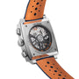 Back view of the TAG Heuer Special Edition Monaco Gulf watch, displaying its exposed Heuer 02 automatic movement, square stainless steel case, and orange perforated leather strap.