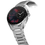The TAG Heuer Connected Calibre E4 is a silver metal smartwatch with a black and red abstract dial, displaying Monday and the 28th, blending cutting-edge tech with true luxury.