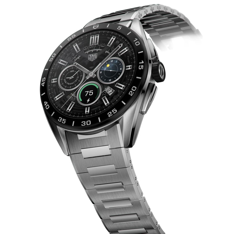 The TAG Heuer Connected Calibre E4 is a luxury smartwatch with avant-garde design, featuring a stainless steel case, black bezel, digital chronograph display, and a partially visible metal bracelet band.