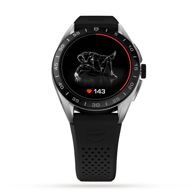 A black TAG Heuer Connected Calibre E4 luxury smartwatch shows a 143 heart rate and an exercise icon of a person doing crunches on its round screen, highlighting its sleek style.