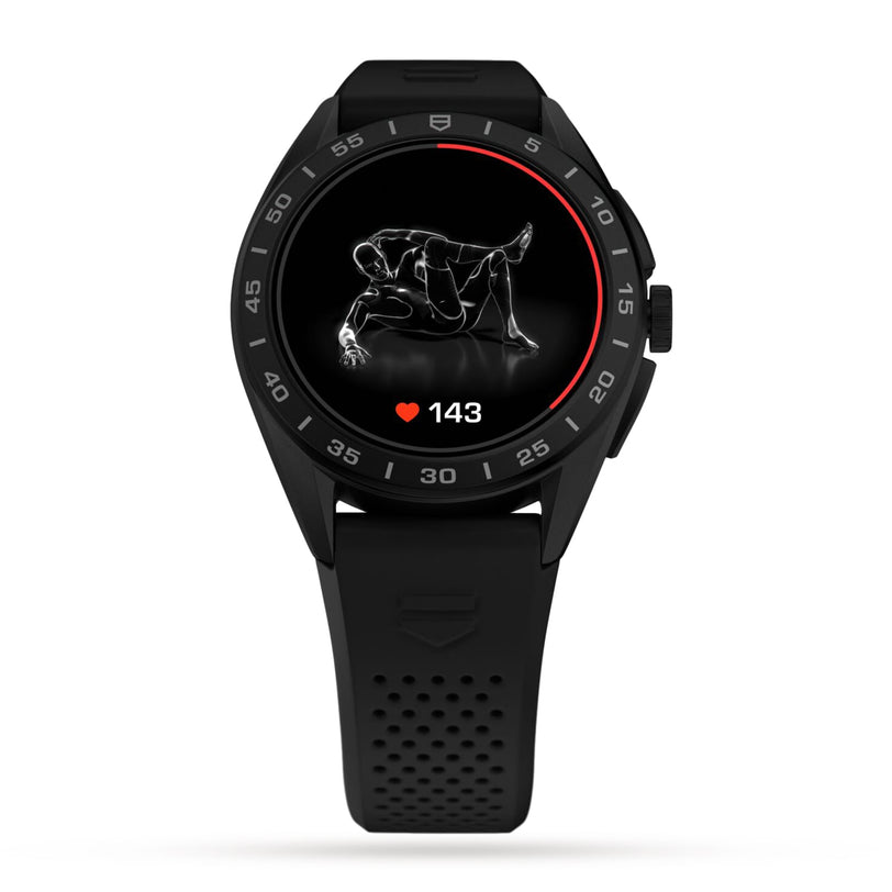 The TAG Heuer Connected Calibre E4 smartwatch with a black titanium case shows a heart rate of 143 bpm and an exercise illustration on its display.