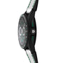 Side view of the TAG Heuer Connected Calibre E4 Golf Edition, a black sports watch with green accents and a white textured band.