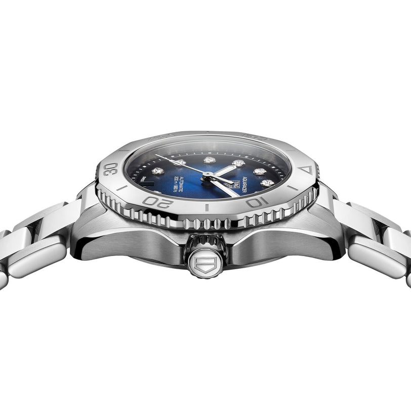 Side view of a TAG Heuer Aquaracer Professional 200 Date sports watch in silver with blue dial, diamond hour markers, stainless steel case, and metal bracelet shown against a white background.
