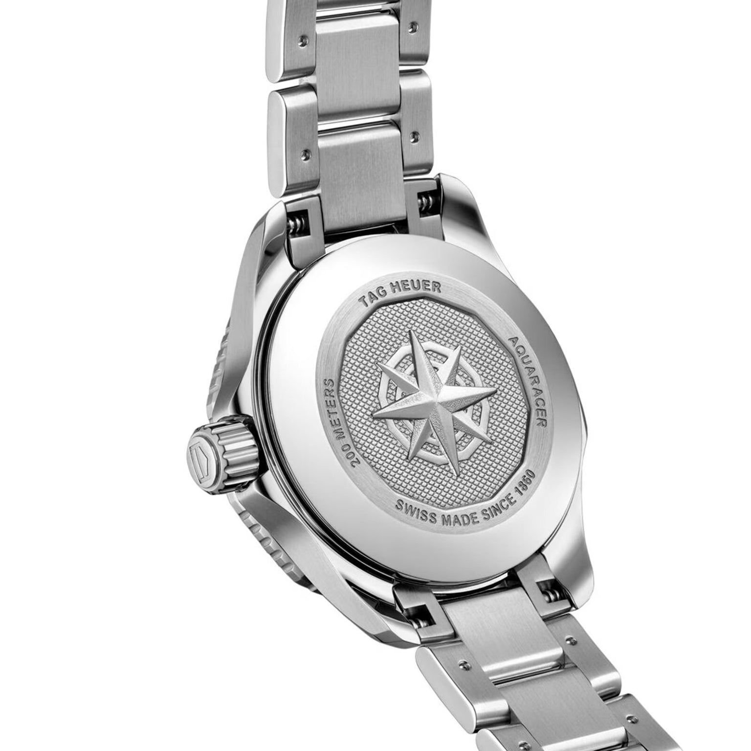 The image displays the back of a TAG Heuer Aquaracer Professional 200 Date watch, featuring a robust stainless steel case with engraved markings, a compass rose design, and a stainless steel bracelet.