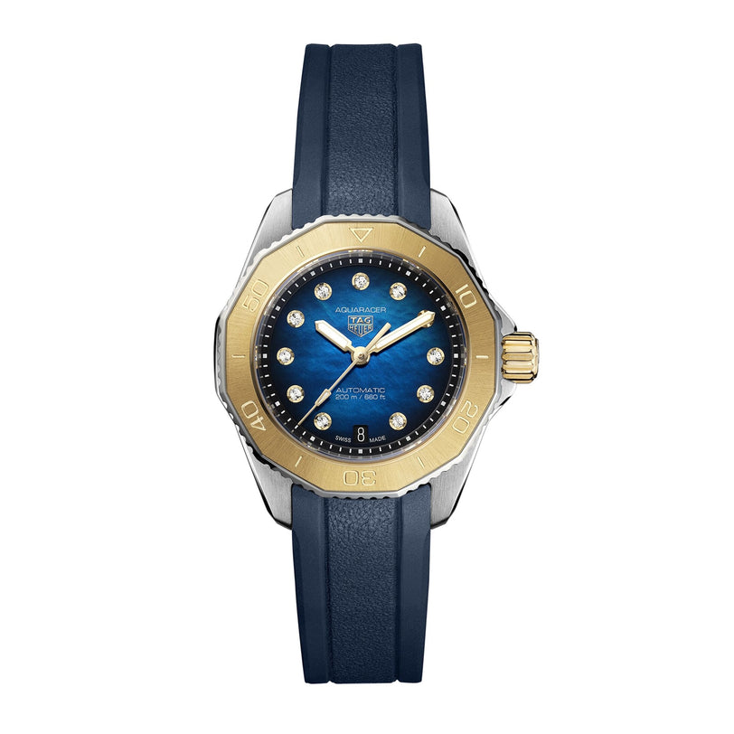 The TAG Heuer Aquaracer Professional 200 Date is a luxury sports watch with a blue face, gold bezel, diamond hour markers, and a dark blue rubber strap.