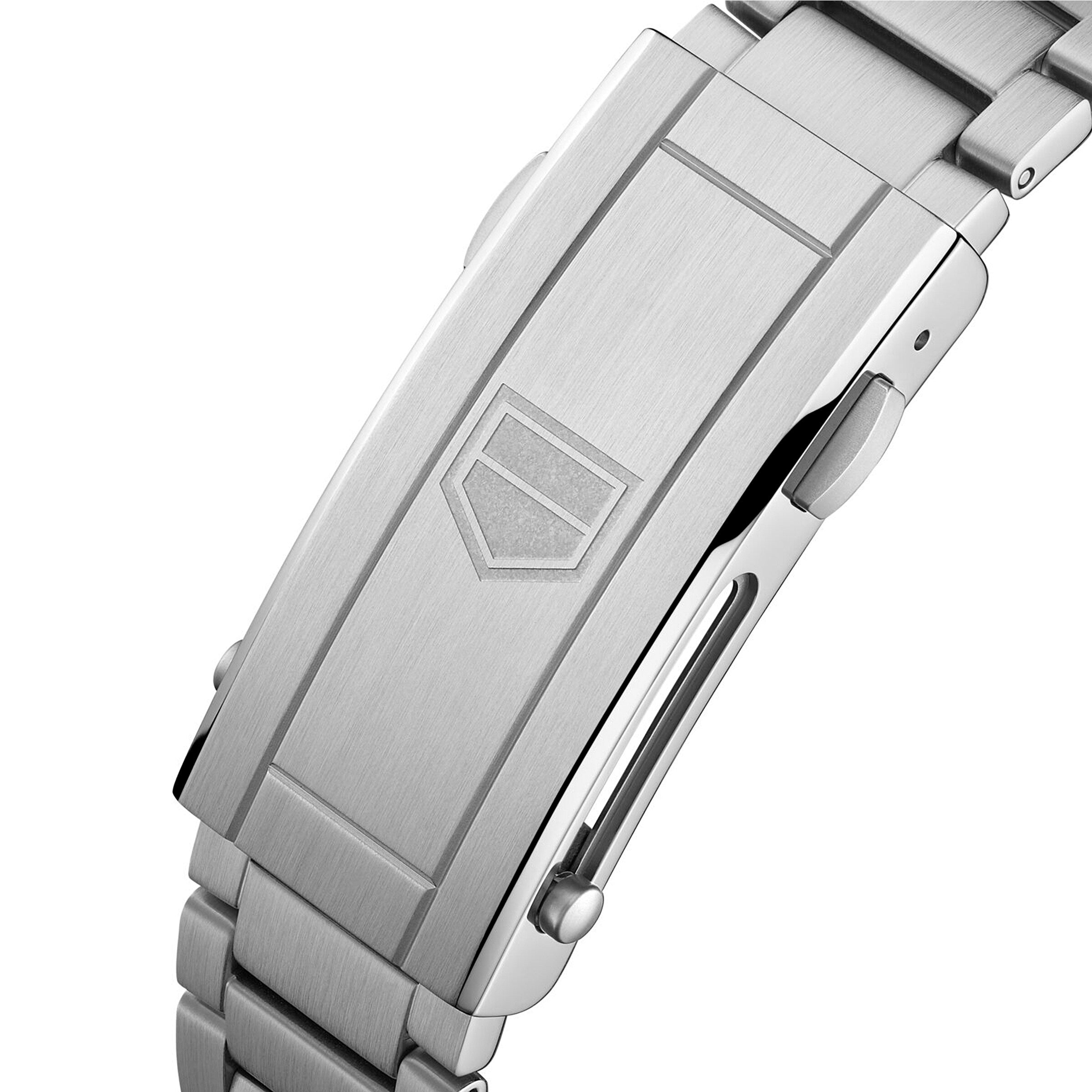 Close-up of a brushed stainless steel clasp engraved with a geometric shield, an iconic detail on the TAG Heuer Aquaracer Professional 300 GMT sports watch.
