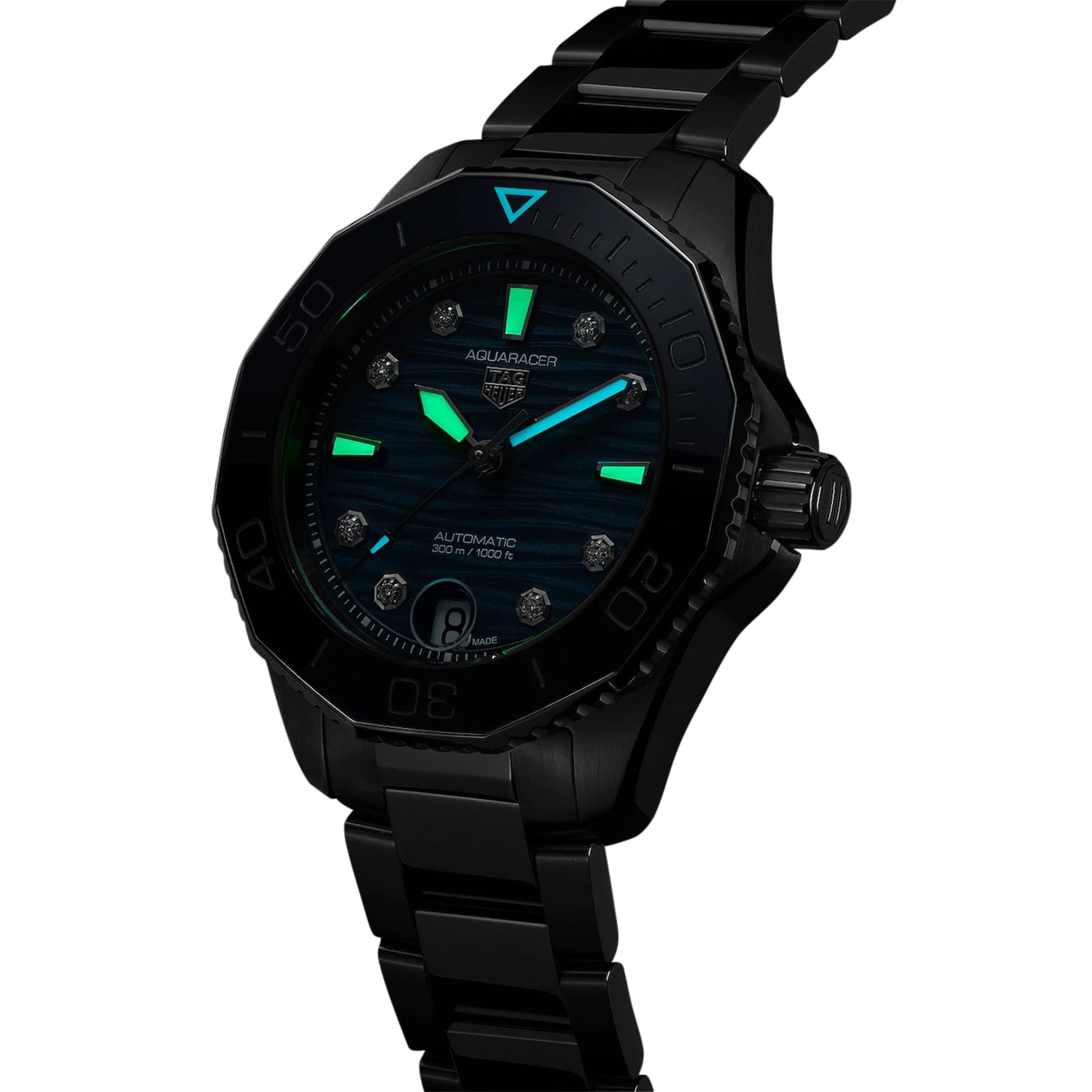 A TAG Heuer Aquaracer Professional 300 Date dive watch with a black dial, luminous hands and markers, shown at an angle on a stainless steel case and bracelet.