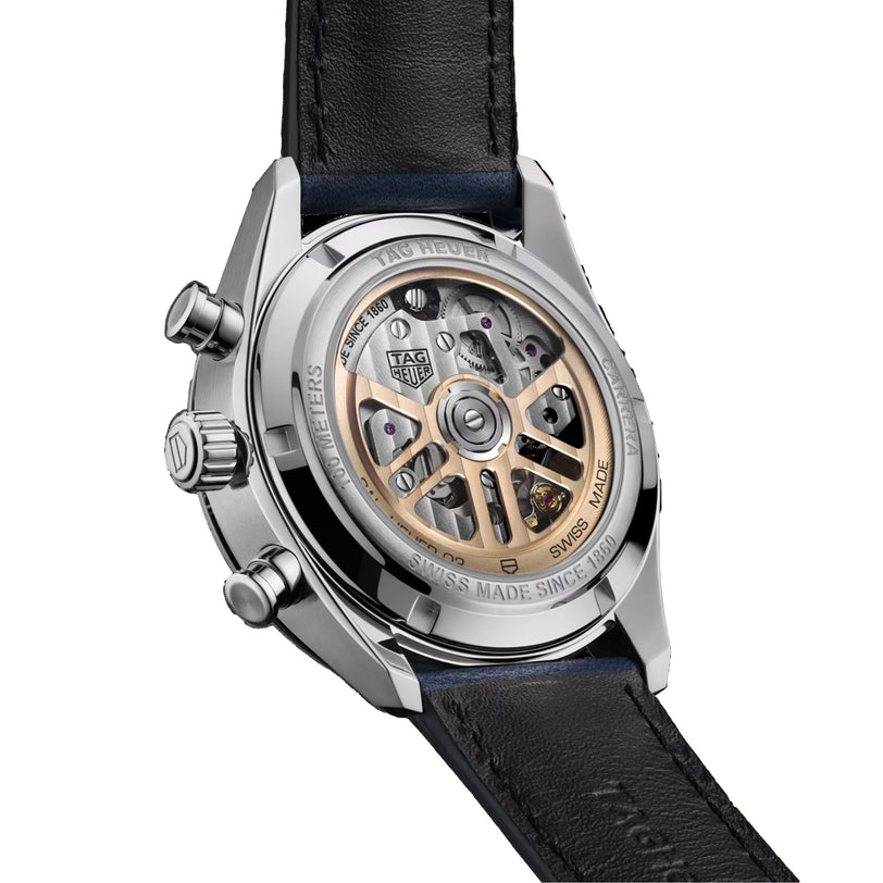 Close-up of the TAG Heuer Carrera Chronographs back, featuring a transparent case that displays the mechanical movement and Panamericana Race-inspired engravings.