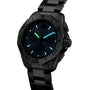 The TAG Heuer Aquaracer Professional 200 Chronograph is a black wristwatch featuring glowing blue and green hands and markers, set against a dark background.
