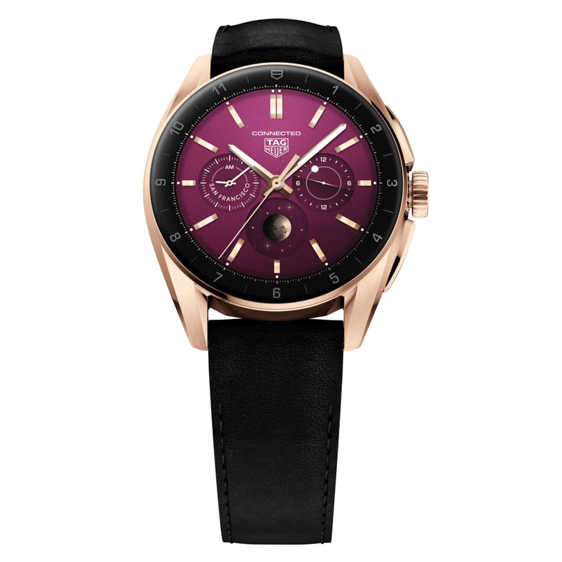 The TAG Heuer Connected Calibre E4 Golden Bright Edition features a gold case, black leather strap, and an eye-catching purple dial with subdials and a moon phase indicator.