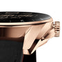 Close-up of the TAG Heuer Connected Calibre E4 Golden Bright Edition shows its black leather strap, crown, pusher, and black dial with white markings—an elegant detail that highlights TAG Heuers sports heritage.