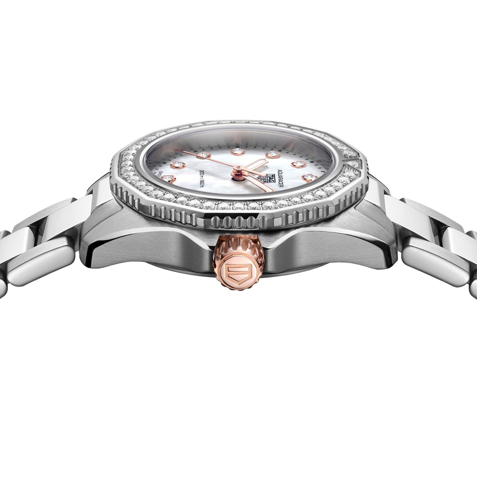 Side view of a TAG Heuer Aquaracer Professional 200 with a silver metal band, diamond-set bezel, mother-of-pearl dial, and rose gold crown and hour markers.