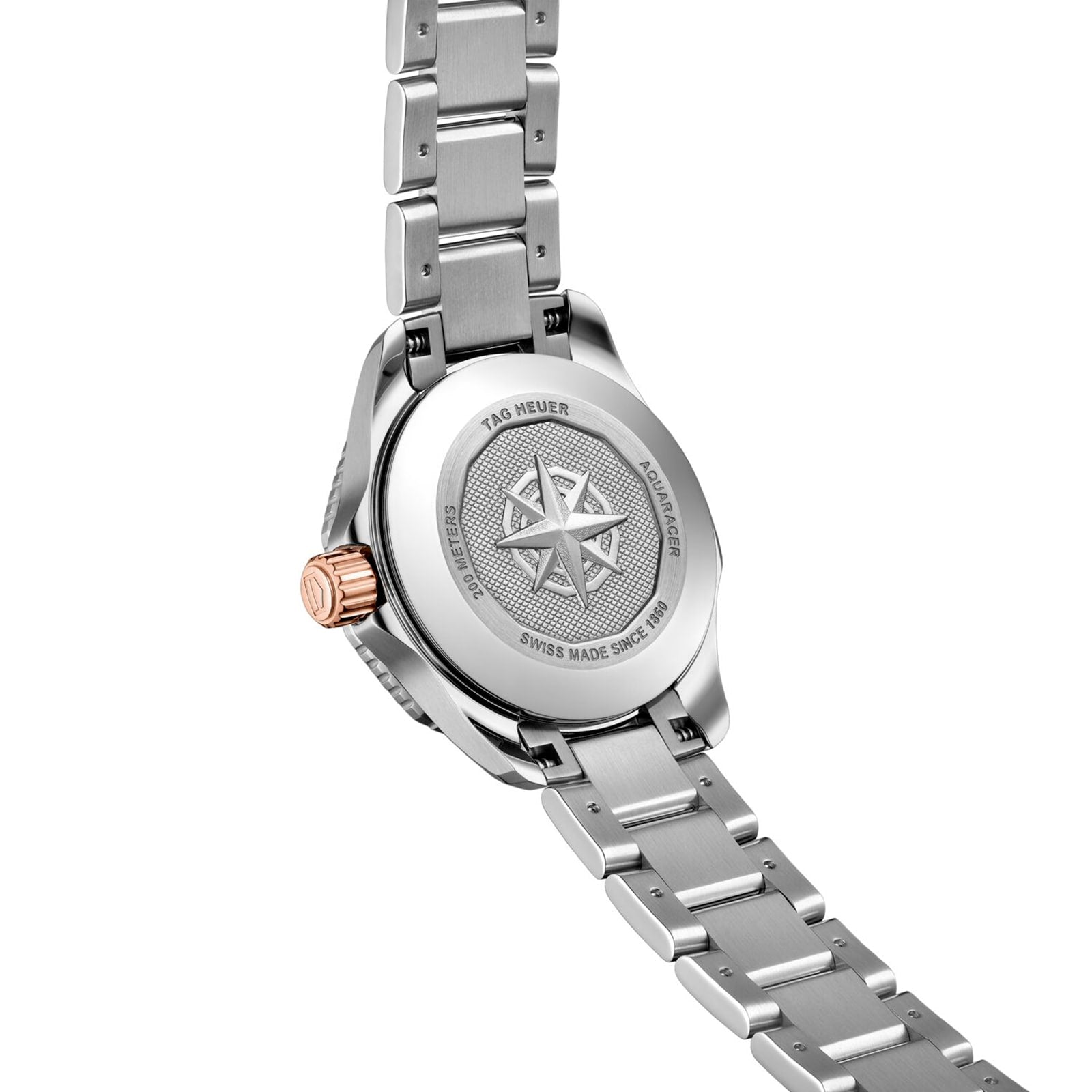 Close-up of the back of a TAG Heuer Aquaracer Professional 200 stainless steel wristwatch featuring engraved star design and branding, attached to a metal link bracelet.
