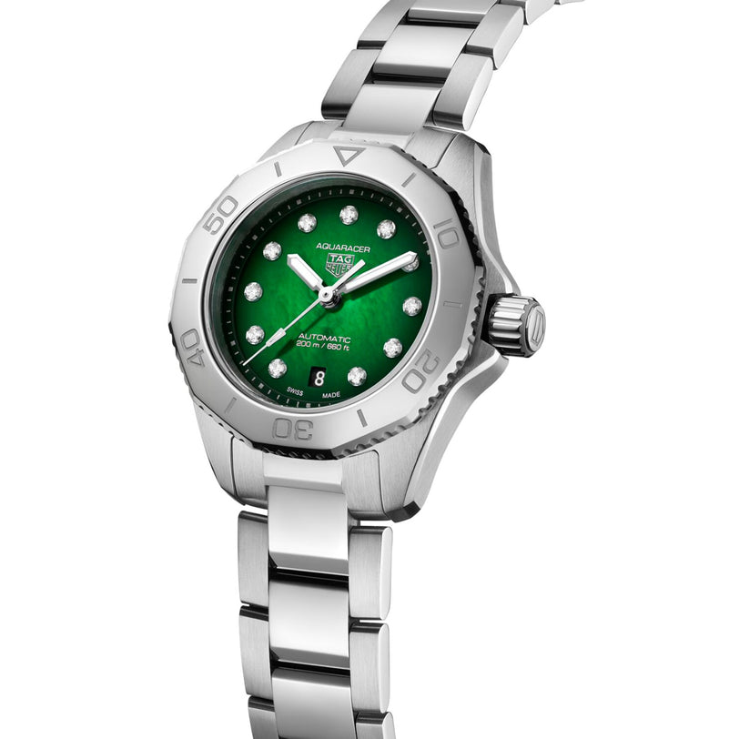 The TAG Heuer Aquaracer Professional 200 is a silver stainless steel sports watch with a green dial, diamond hour markers, and a rotating bezel.