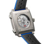 Close-up of the back of a TAG Heuer Limited Edition Monaco Chronograph French Racing Blue, showing its automatic chronograph movement, branding, engraved details, and black and blue perforated leather strap.