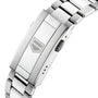 Close-up of the TAG Heuer Aquaracer Professional 200s stainless steel bracelet clasp, showcasing a rectangular badge with the geometric TAG Heuer logo engraved at its center.