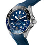 The TAG Heuer Aquaracer Professional 300 GMT is a luxury watch with a blue dial, blue and black bezel, blue rubber strap, and automatic movement, displaying the time at 10:10.