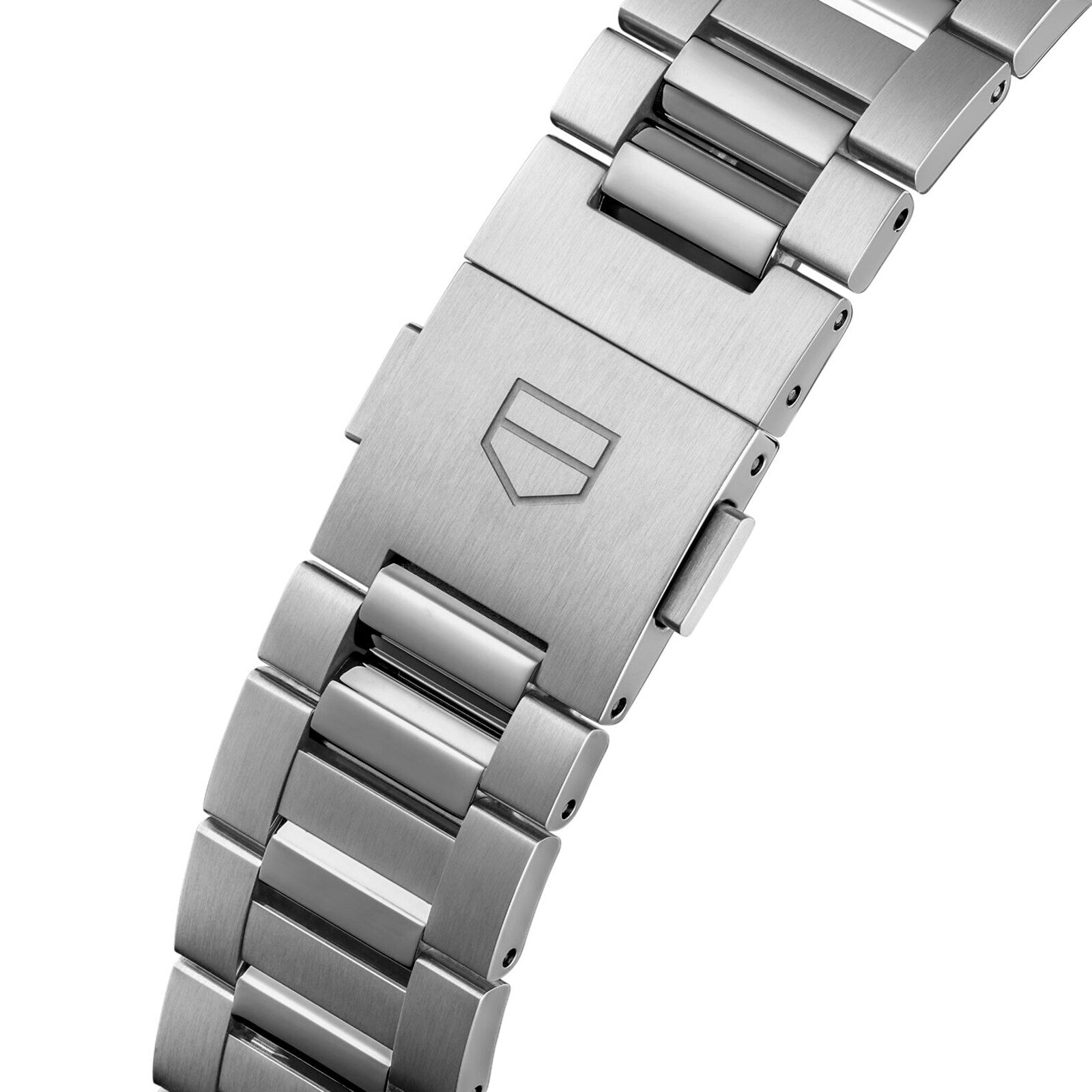 Close-up of a TAG Heuer Carrera Chronograph stainless steel bracelet with folding clasp, engraved shield logo, and durable sapphire crystal.