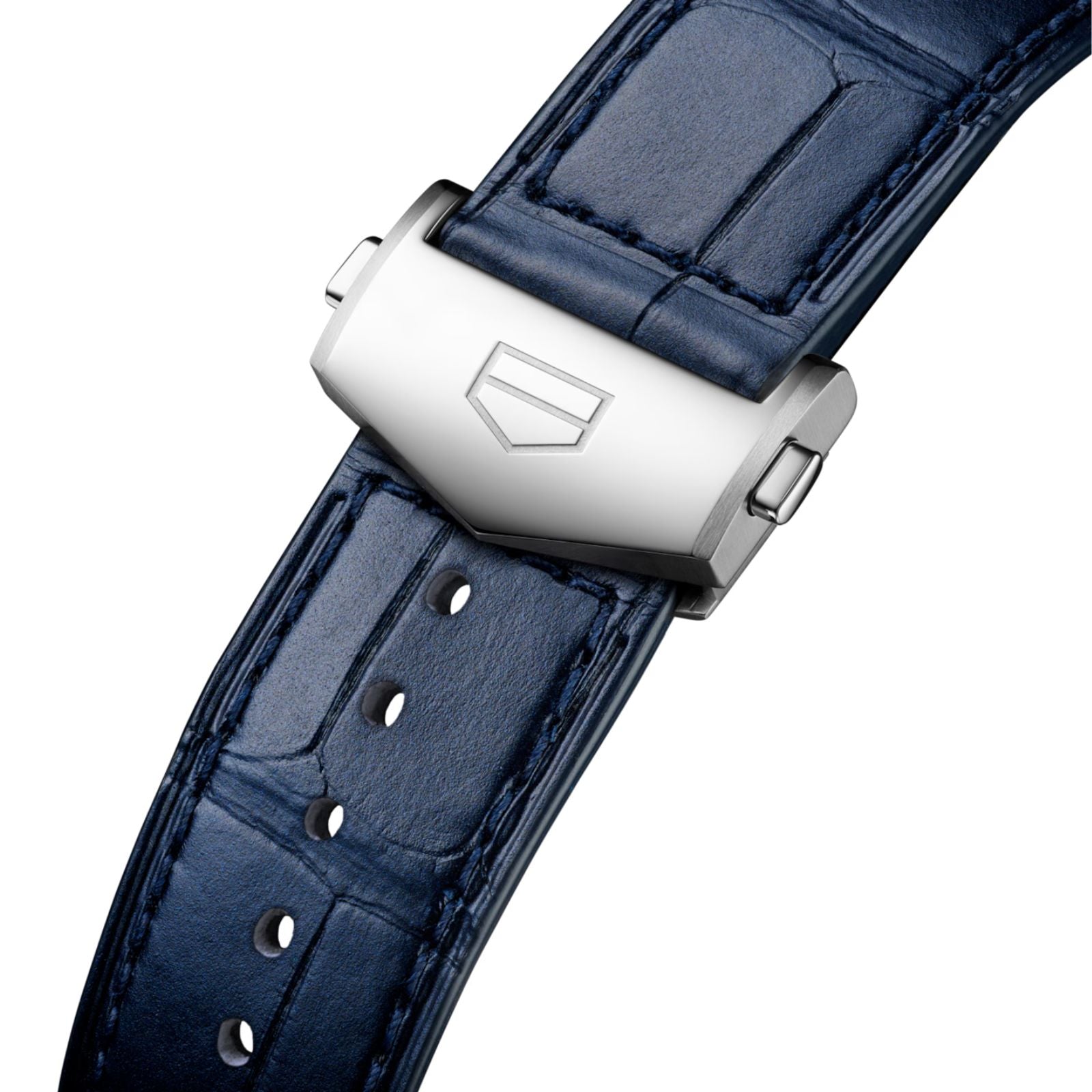 Close-up of a blue leather strap with a silver clasp, featuring the engraved shield logo of TAG Heuer on the Carrera Chronograph.