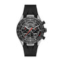 A TAG Heuer Limited Edition Carrera Chronograph x Porsche 963 wristwatch with a black rubber strap, skeleton dial, and three subdials is displayed against a white background.