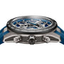 Close-up side view of the TAG Heuer Carrera Chronograph Extreme Sport, featuring a blue strap, exposed gears powered by the TH20-00 movement, and three metal pushers on the side.