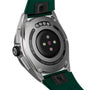 Back of a TAG Heuer Connected Calibre E4 smartwatch with green strap, sensors, and 50 meters water resistance engraved.
