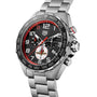 The TAG Heuer Special Edition Formula 1 X Indy 500 watch boasts a silver metal band, black textured dial with red and white accents, three subdials, and precise quartz chronograph movement.