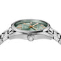 A close-up side view of the TAG Heuer Carrera Date wristwatch featuring a green sunray-brushed dial, gold hour markers, and a silver metal link band.