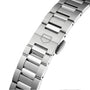 Close-up of the TAG Heuer Carrera Date’s stainless steel bracelet with a brushed clasp and engraved shield logo, set against a plain white background.
