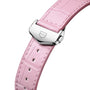Close-up of a pink leather watch strap with a silver buckle and engraved geometric logo. Pair it with the TAG Heuer Carrera Calibre 7 for timeless sophistication, featuring TAG Heuer’s signature style and elegant design.