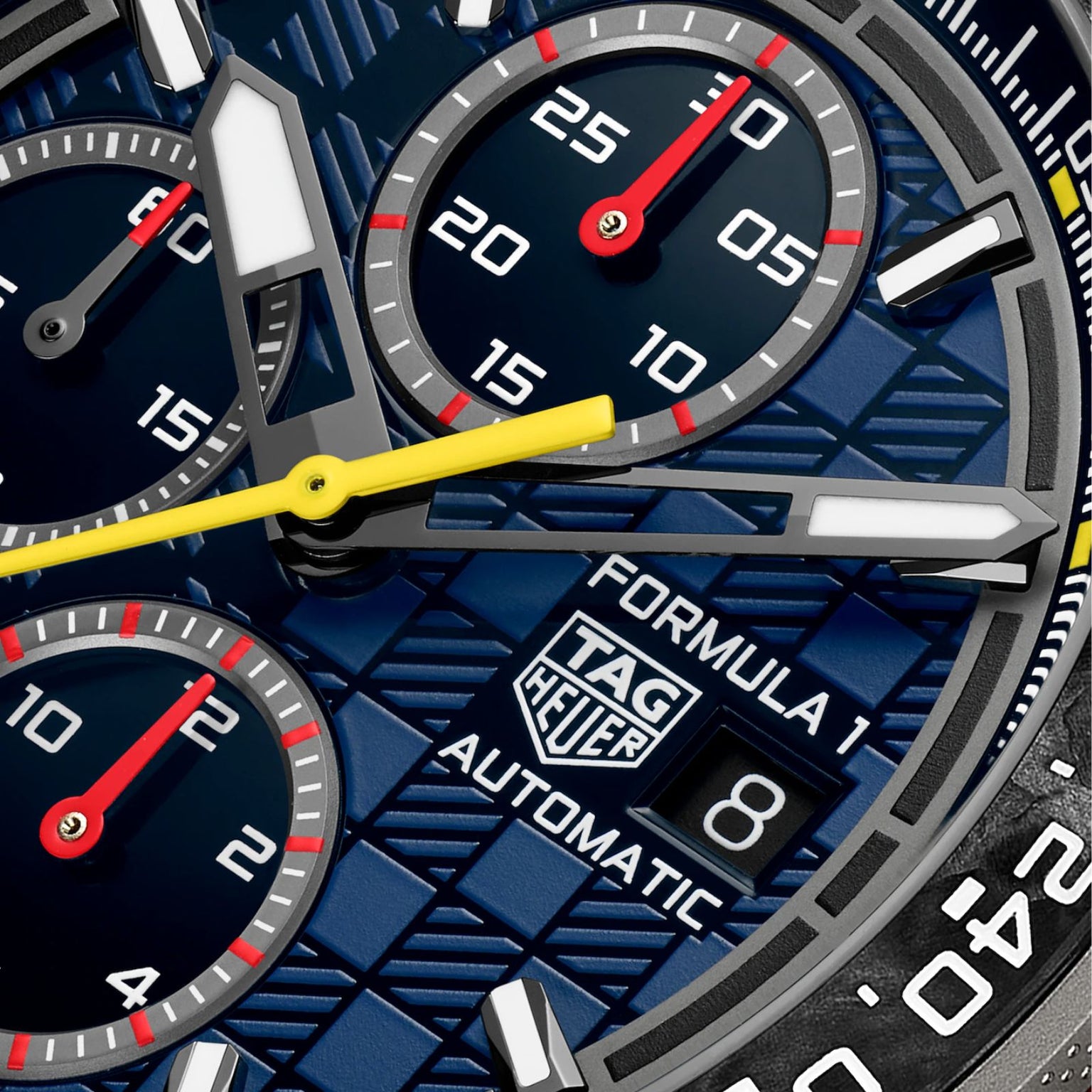 Close-up of a TAG Heuer Formula 1 Chronograph X Oracle Red Bull Racing watch face featuring three subdials and a date window.