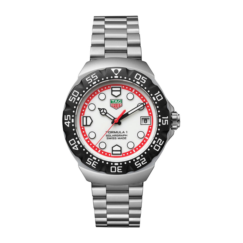 The TAG Heuer Formula 1 Solargraph is a silver watch featuring a white and red dial, black bezel, and metal bracelet.
