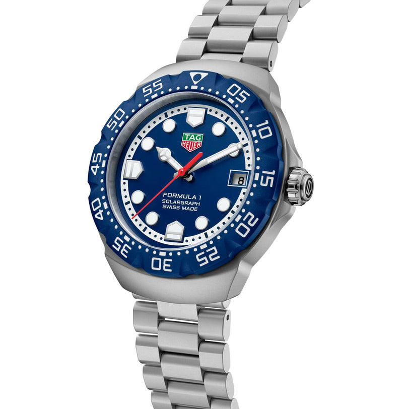 Silver TAG Heuer Formula 1 Solargraph wristwatch featuring a blue dial and bezel, displayed at a slight angle.