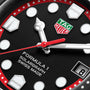 Close-up of a TAG Heuer Formula 1 Solargraph watch face, featuring hands, logo, date window, and intricate hour markers.