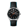 A TAG Heuer Carrera Day Day-Date watch with a black dial, day-date display, and a black leather strap with blue edges.