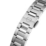 Close-up of a TAG Heuer Carrera Date stainless steel watch bracelet featuring a clasp engraved with a geometric logo.
