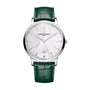 The Vacheron Constantin Patrimony Self-Winding limited edition wristwatch in 18K white gold features a white patterned dial, date window, and green leather strap, shown on a white background.