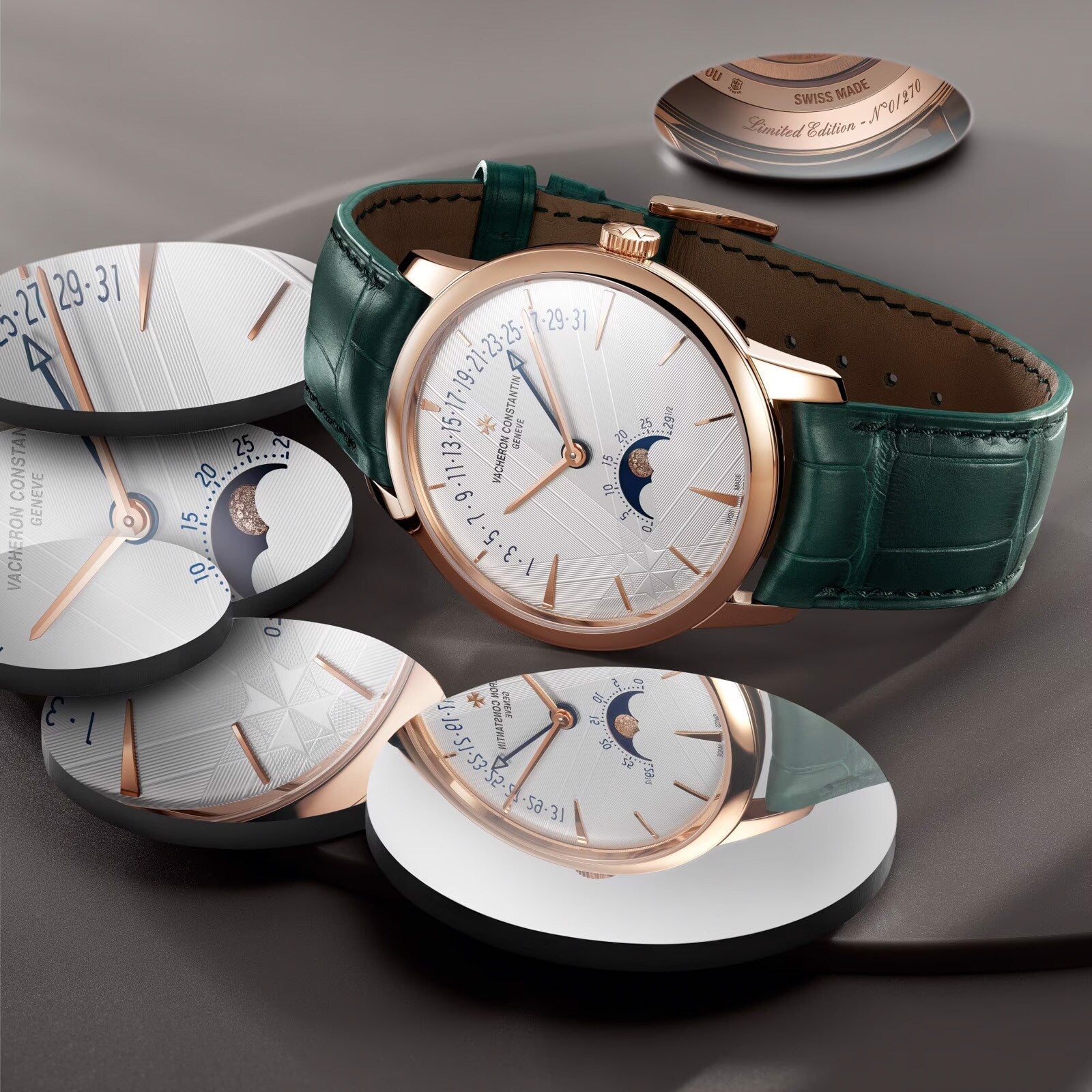 The Vacheron Constantin Patrimony Moon Phase Retrograde Date is a limited edition luxury wristwatch with a green leather band, 18K pink gold case, and moon phase dial, elegantly showcased on a gray surface.