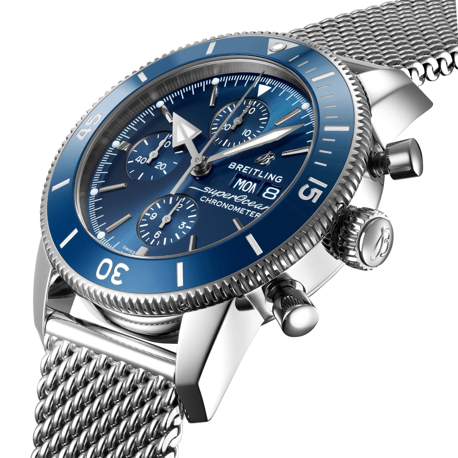 A close-up of a Breitling Superocean Heritage Chronograph 44 with a blue dial, stainless steel mesh bracelet, and three subdials powered by the Breitling 13 calibre.