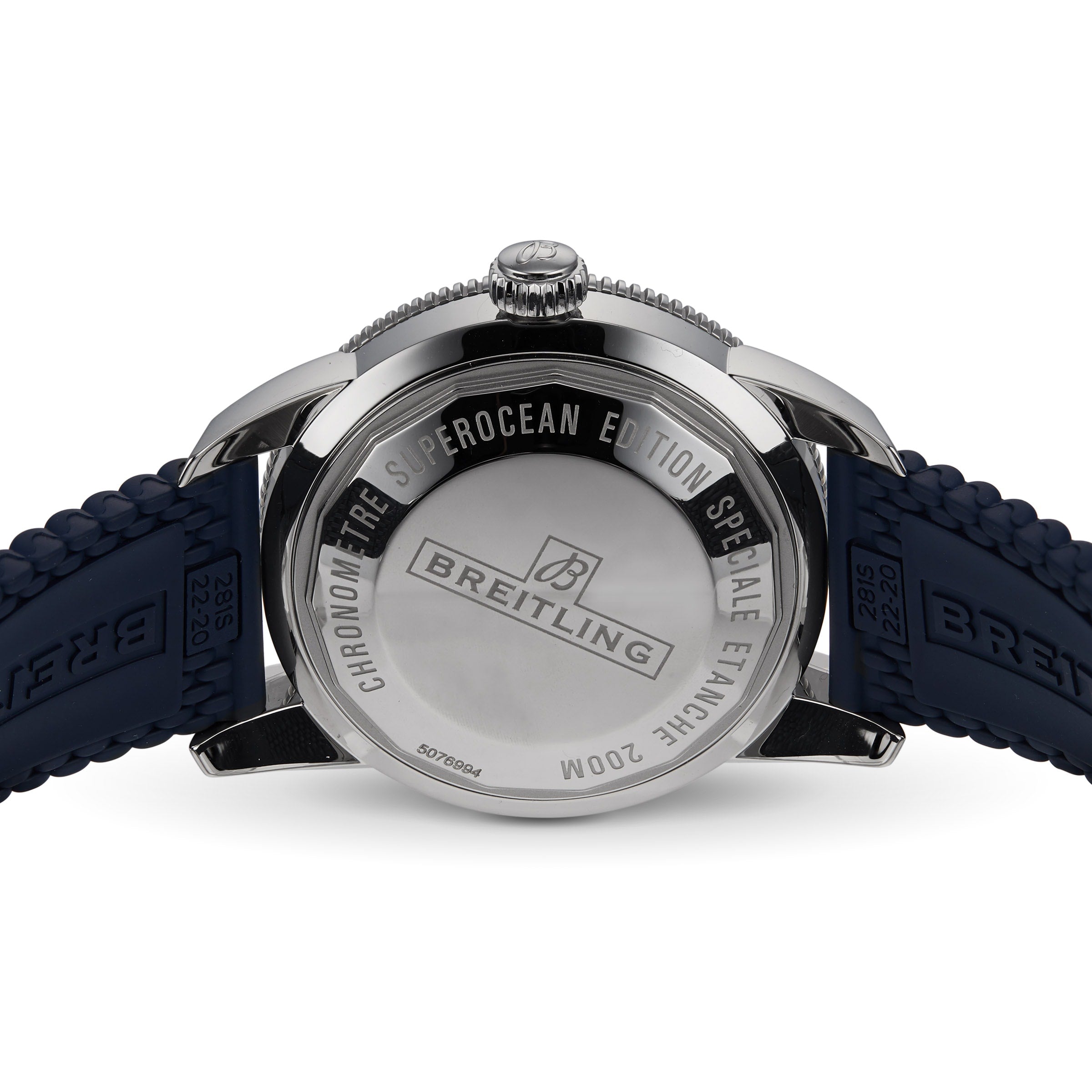 The back of the Breitling Superocean Heritage B20 Automatic 44 is shown, featuring engraved text highlighting its 200M water resistance and celebrated diver’s watch heritage, paired with a blue braided strap.