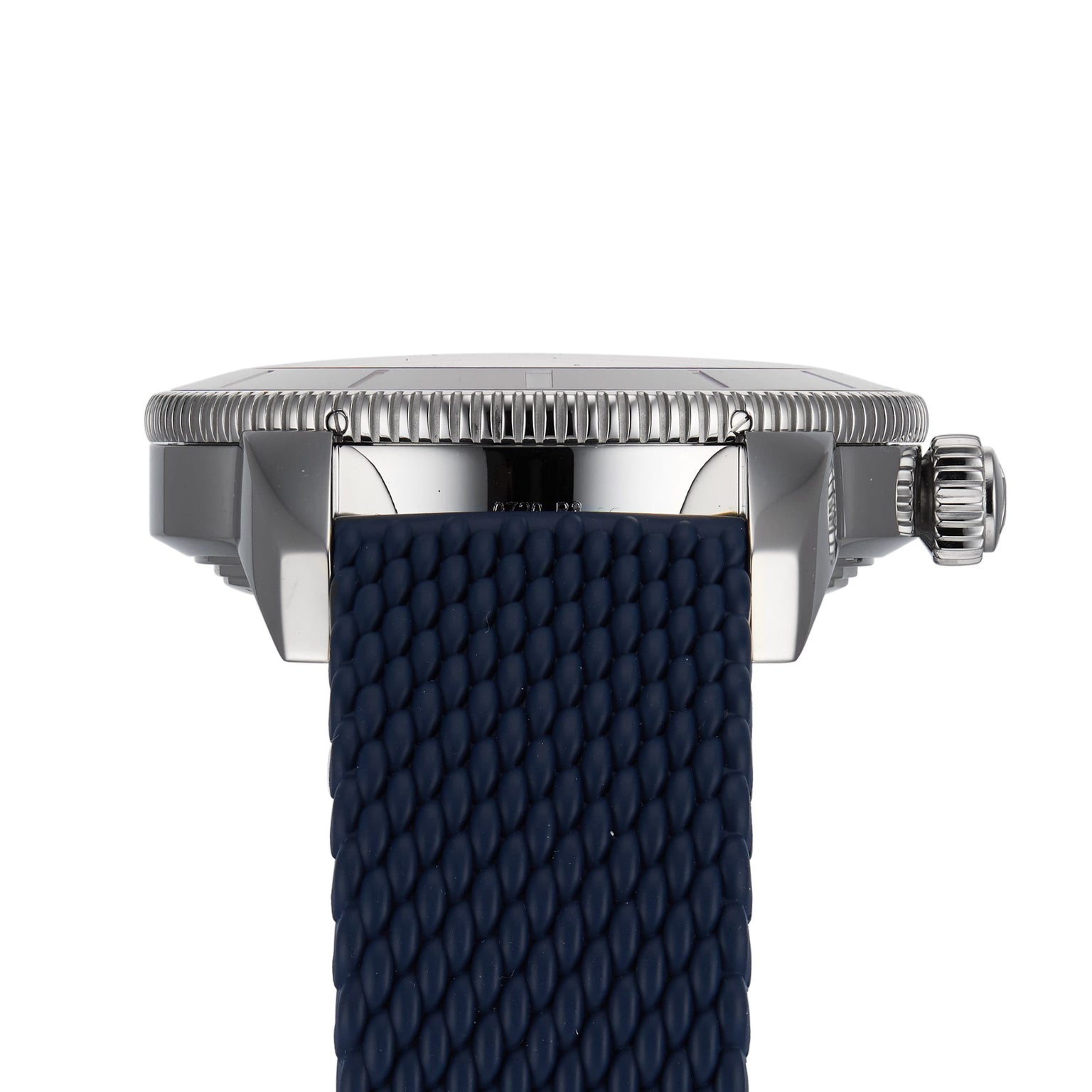 Side view of the Breitling Superocean Heritage B20 Automatic 44 featuring a textured navy blue strap, ridged bezel, and prominent crown and lugs—capturing the elegance of this diver’s watch.